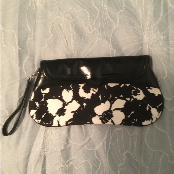 White House Black Market Wristlet. Black and white floral print. Never used.